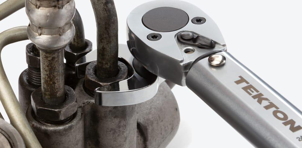 Tekton crowfoot wrench on a torque wrench tightening a fastener