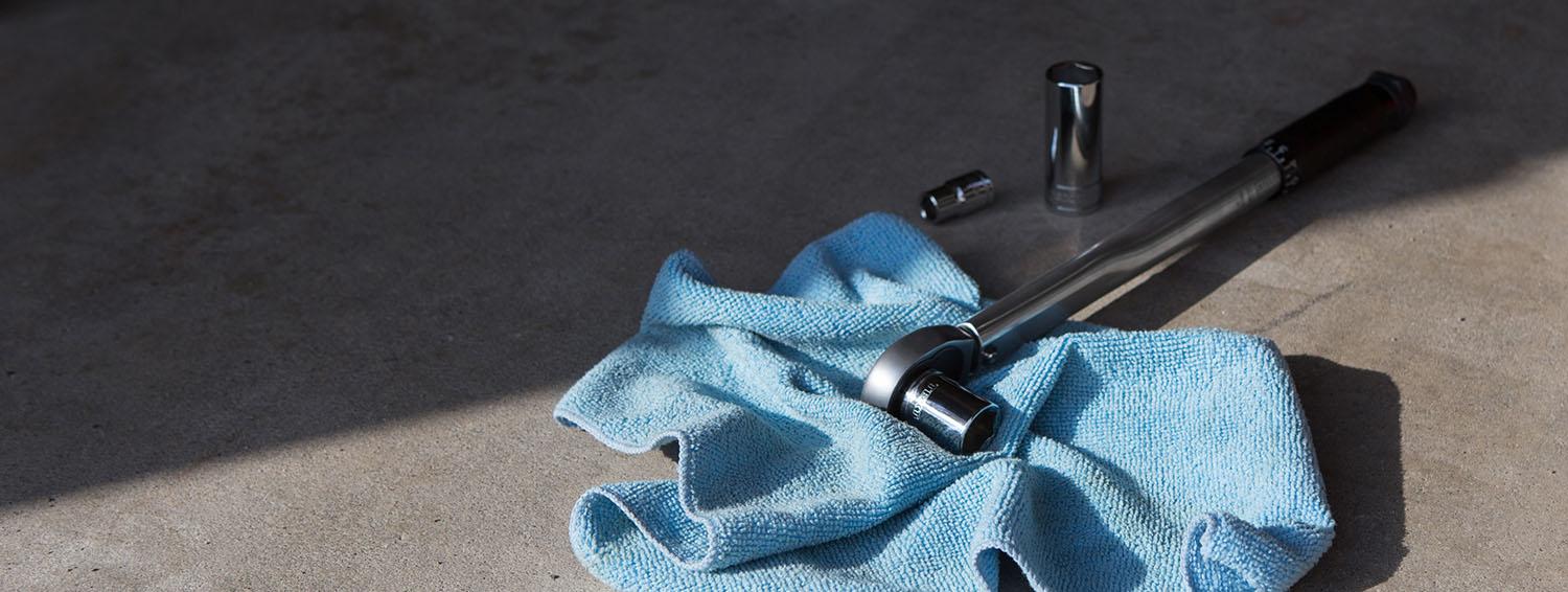 A Tekton micrometer torque wrench with a socket attached.