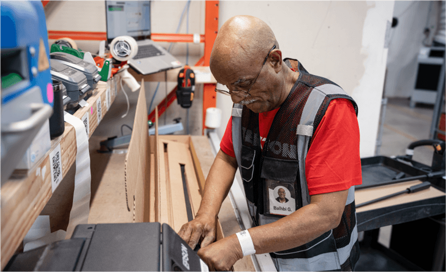 Tekton fulfillment specialist assembling a shipping box to ship hand tools.