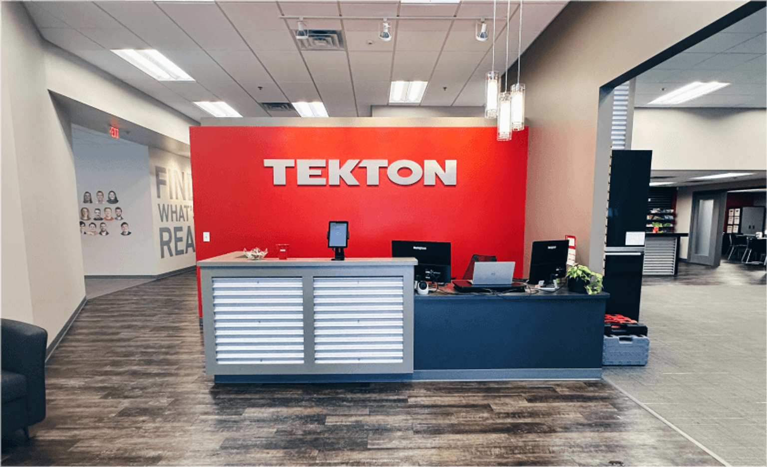 An empty office with large front desk.