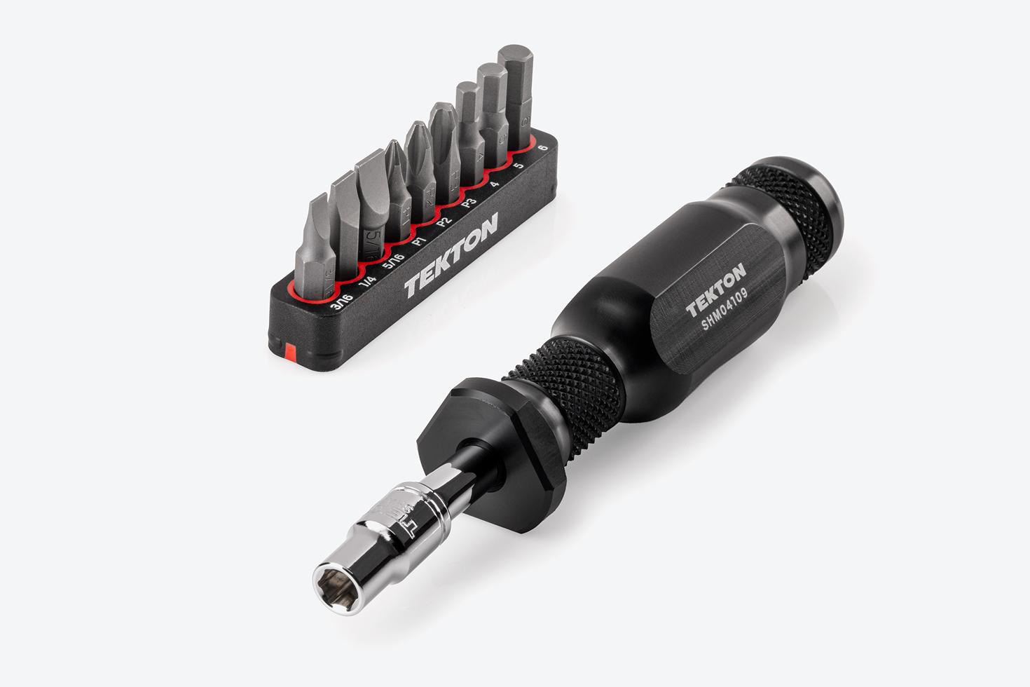 A 5 inch spinner handle and hex bit holder next to a rail of 1/4 inch slotted, Phillips, and hex bits