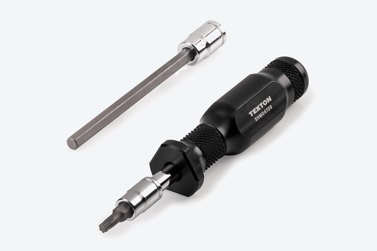 A 5 inch spinner handle connected to a star bit socket next to a long hex bit socket