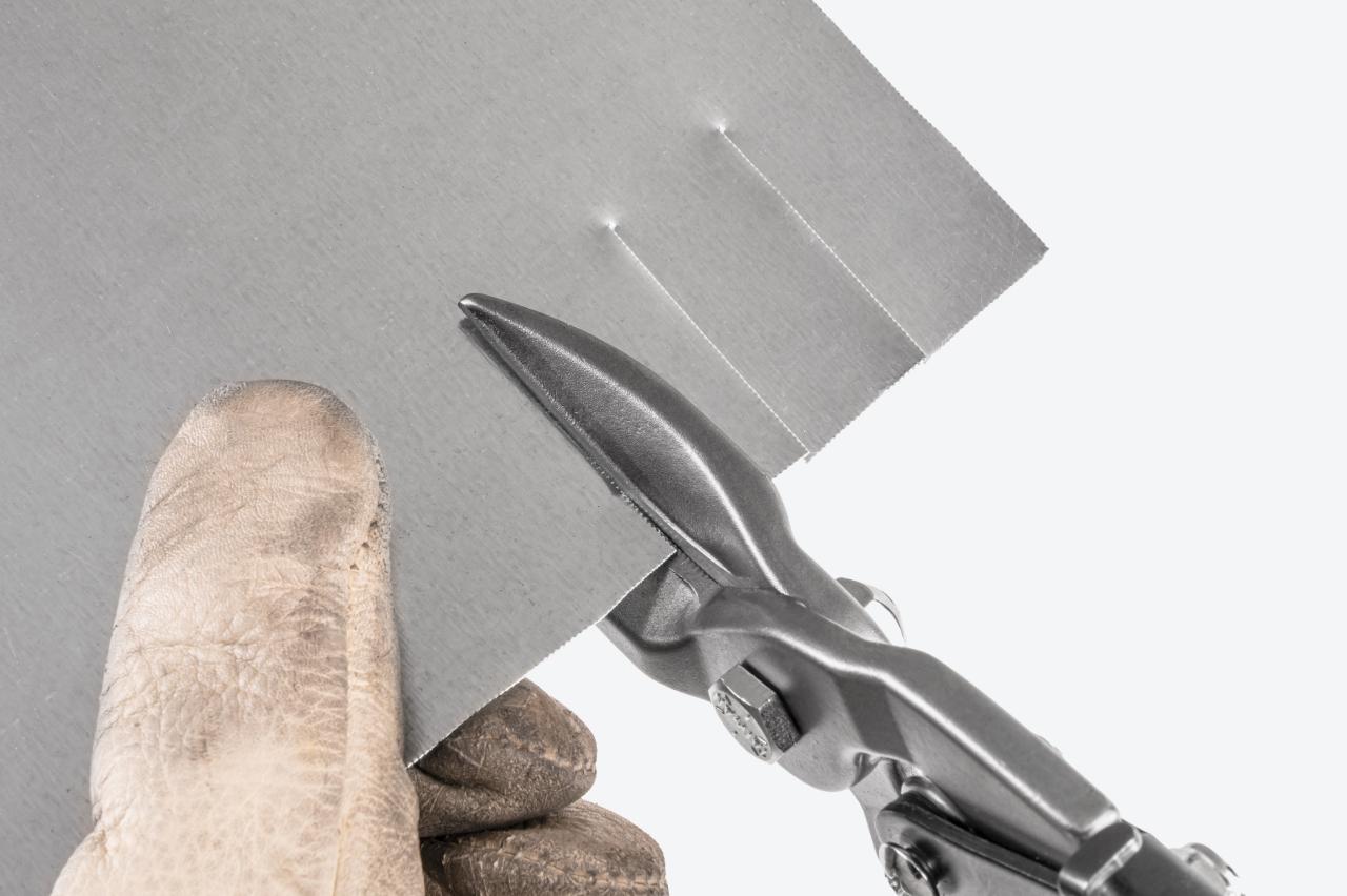 Snips cutting sheet metal