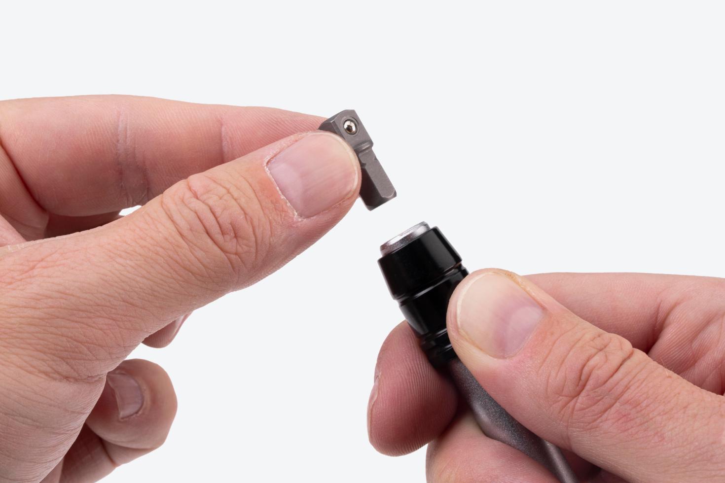 An adapter being removed from a driver