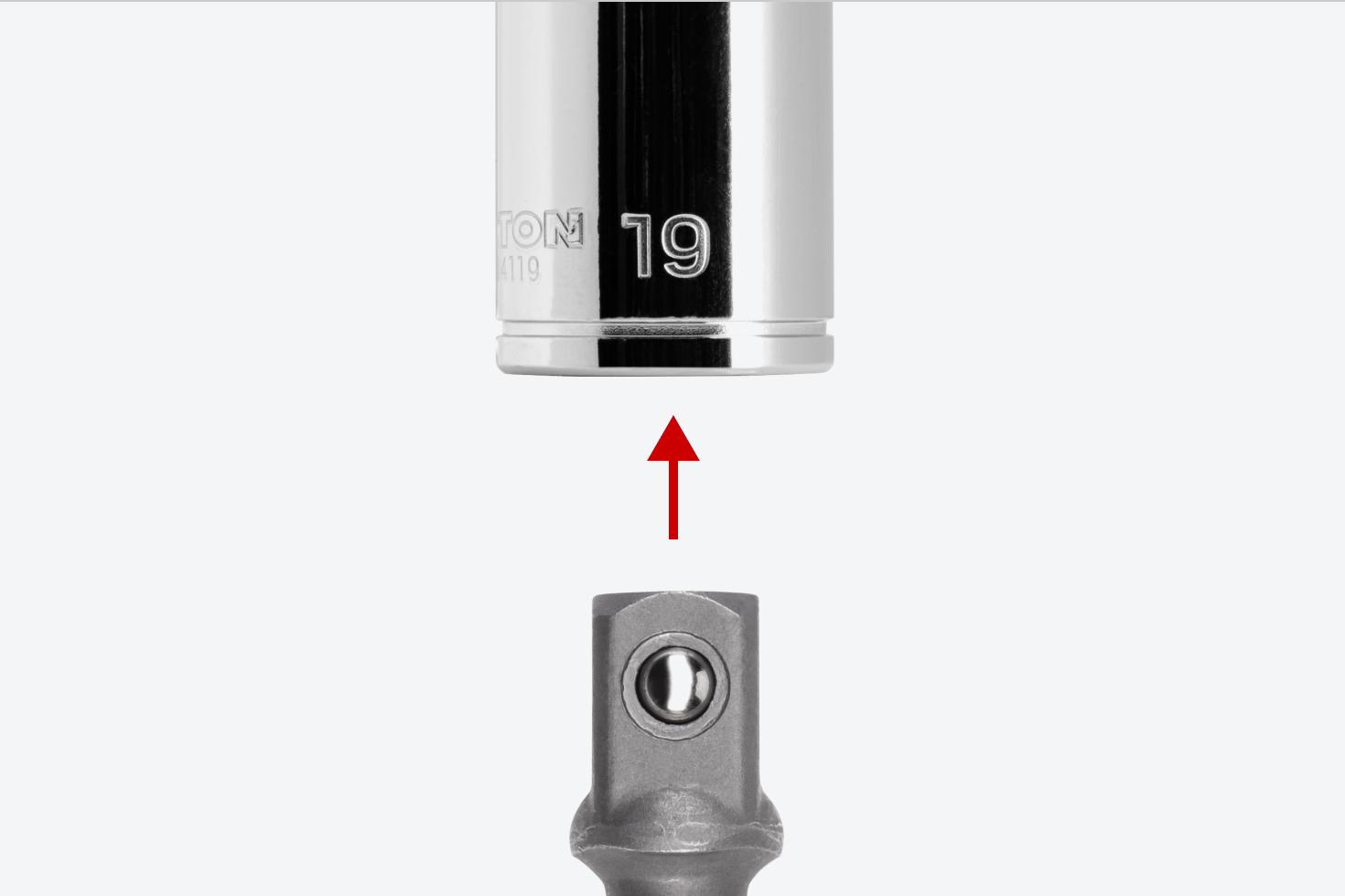 An adapter and a 3/8 inch drive socket