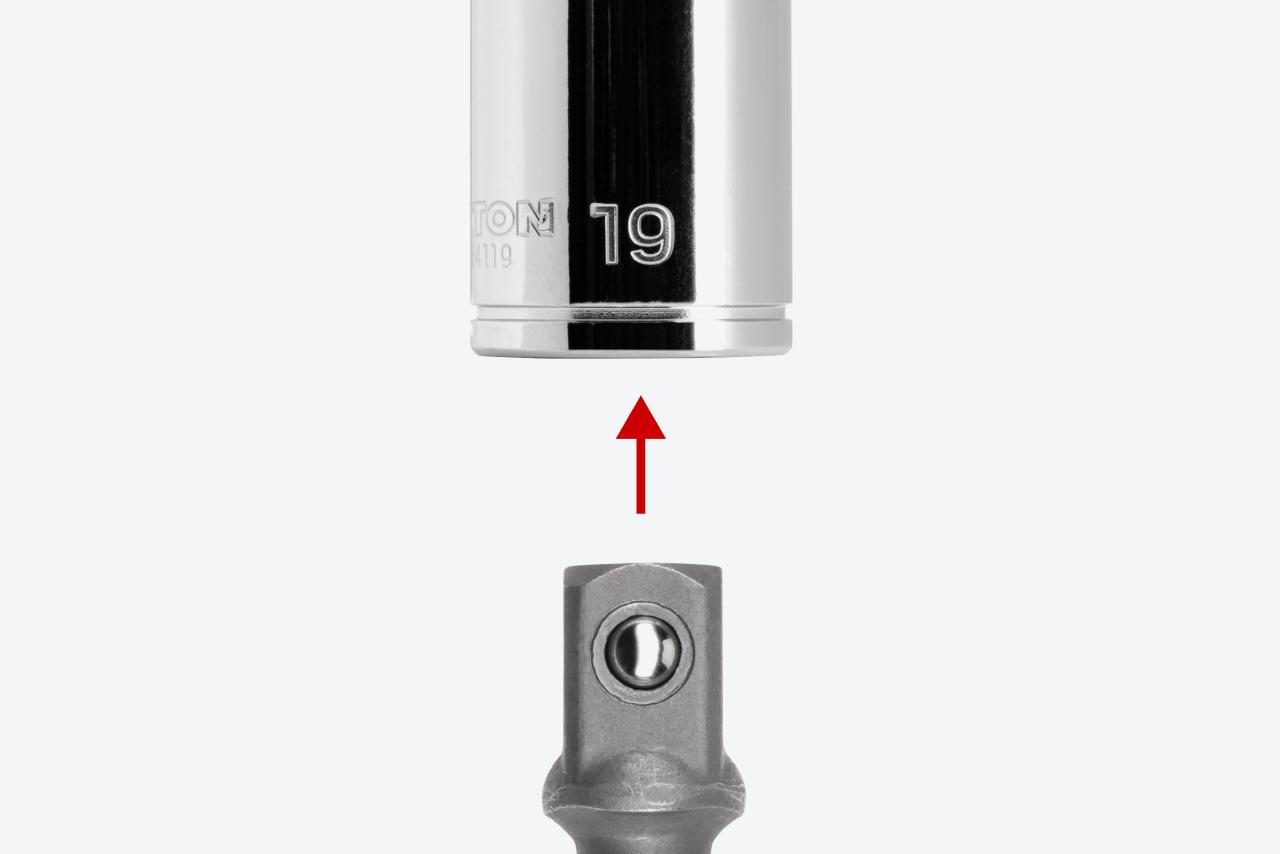 An adapter and a 3/8 inch drive socket