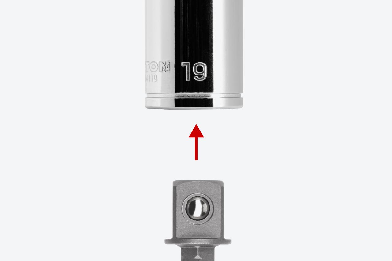 An adapter and a 3/8 inch drive socket