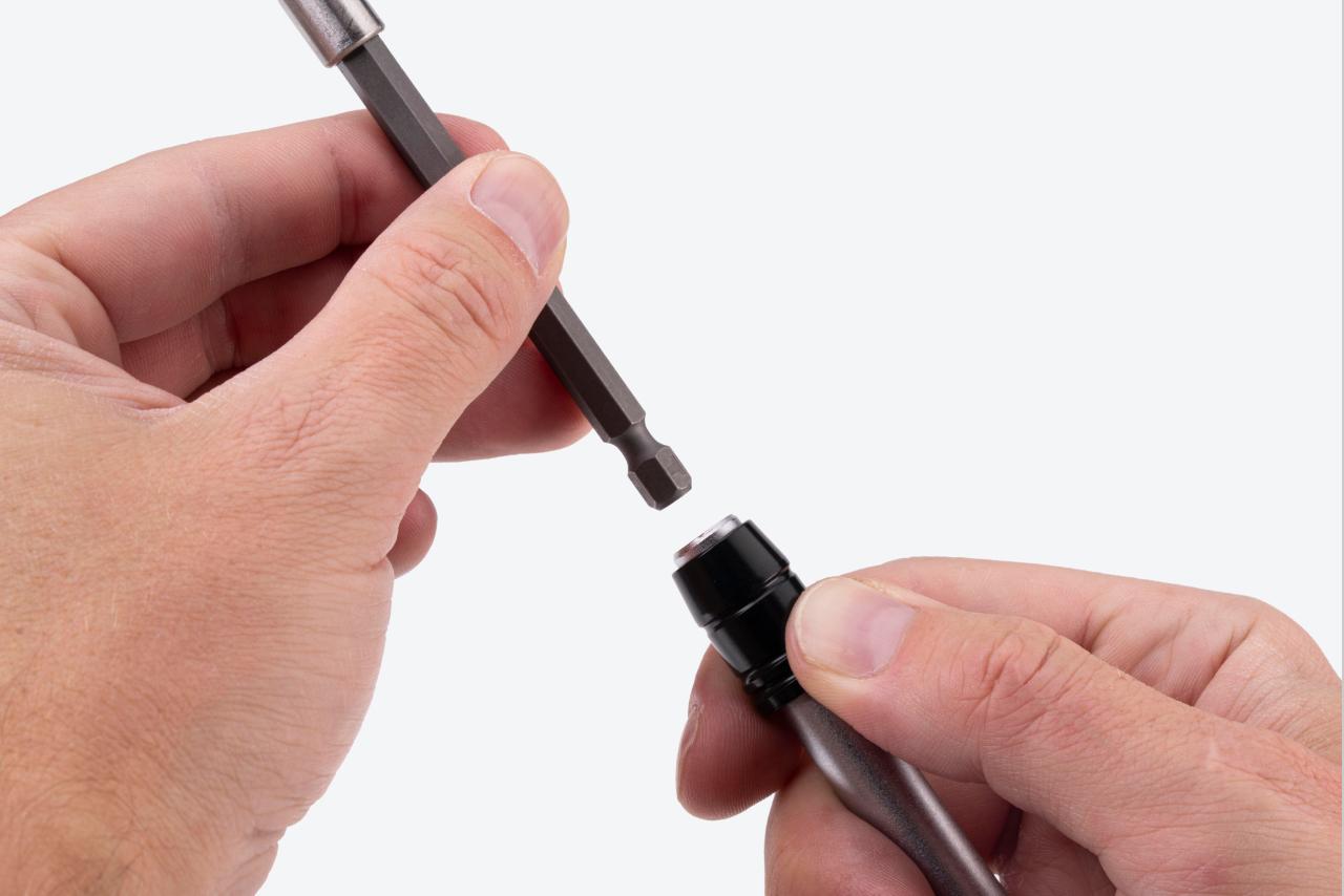 A bit holder extension being removed from a driver