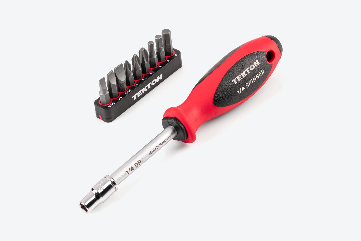 A spinner handle and hex bit holder next to a rail of 1/4 inch slotted, Phillips, and hex bits