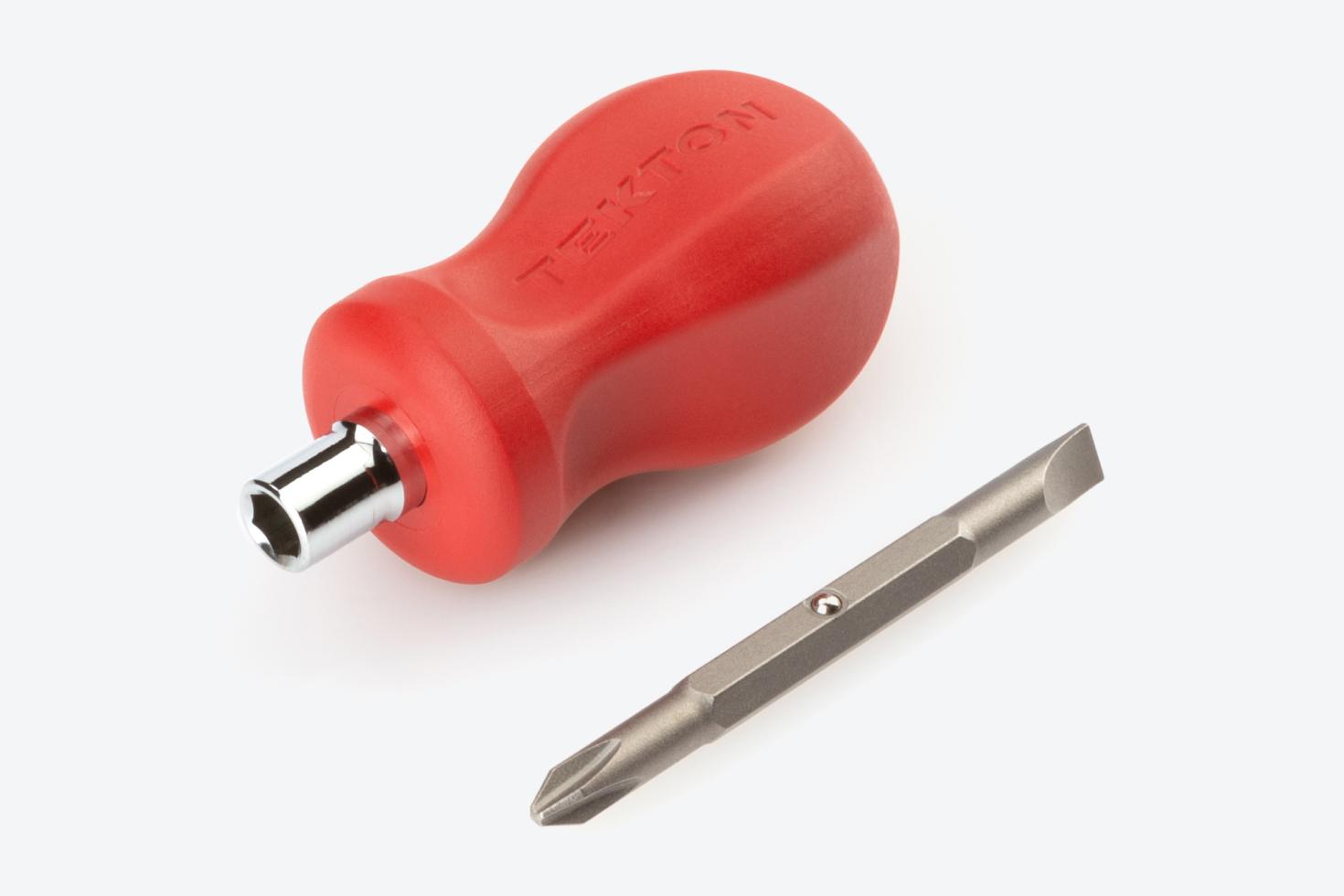 A Phillips/slotted screwdriver bit next to a red 3-in-1 stubby driver handle