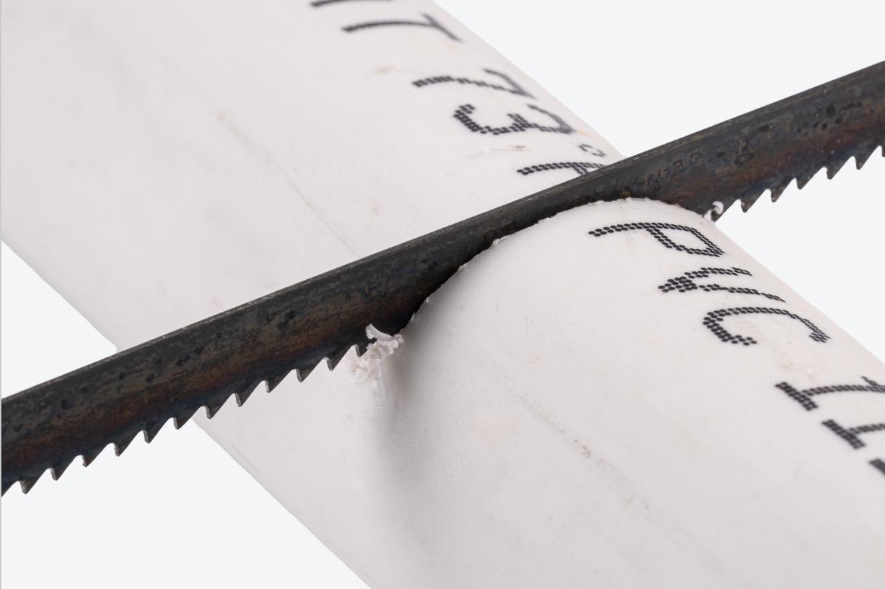 A 14 TPI blade cutting a PVC pipe