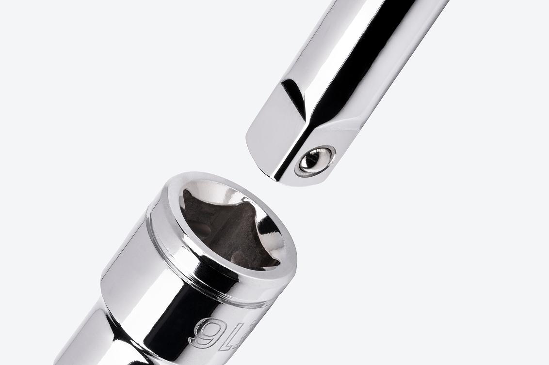 A hand drive extension going into the drive end of a Tekton 1/2 Inch Drive x E16 External Star Socket.