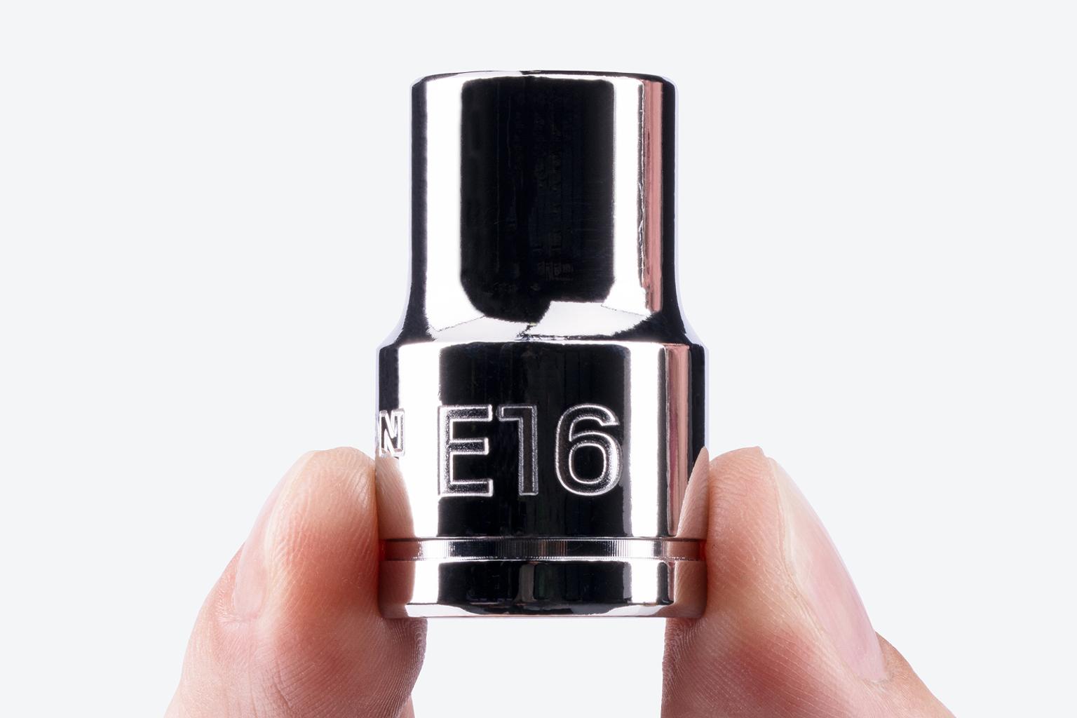 A Tekton 1/2 Inch Drive x E16 External Star Socket being held, showing the large stamped "E16" markings.