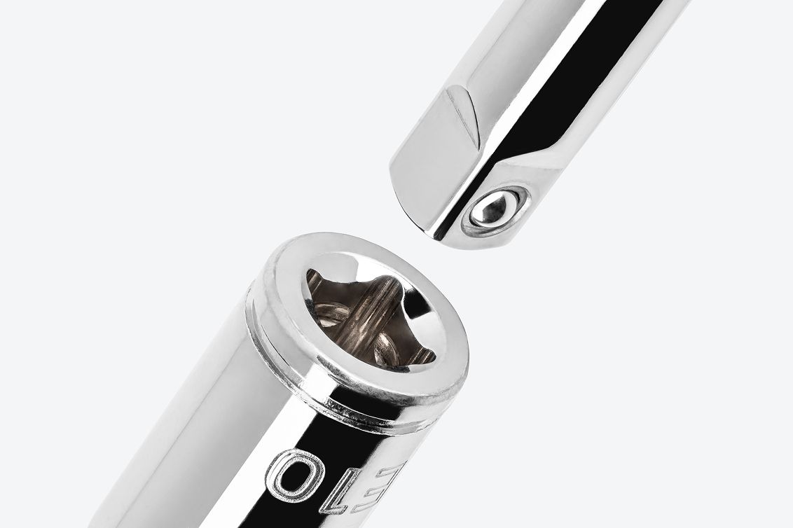 A hand drive extension going into the drive end of a Tekton 1/4 Inch Drive x E10 External Star Socket.