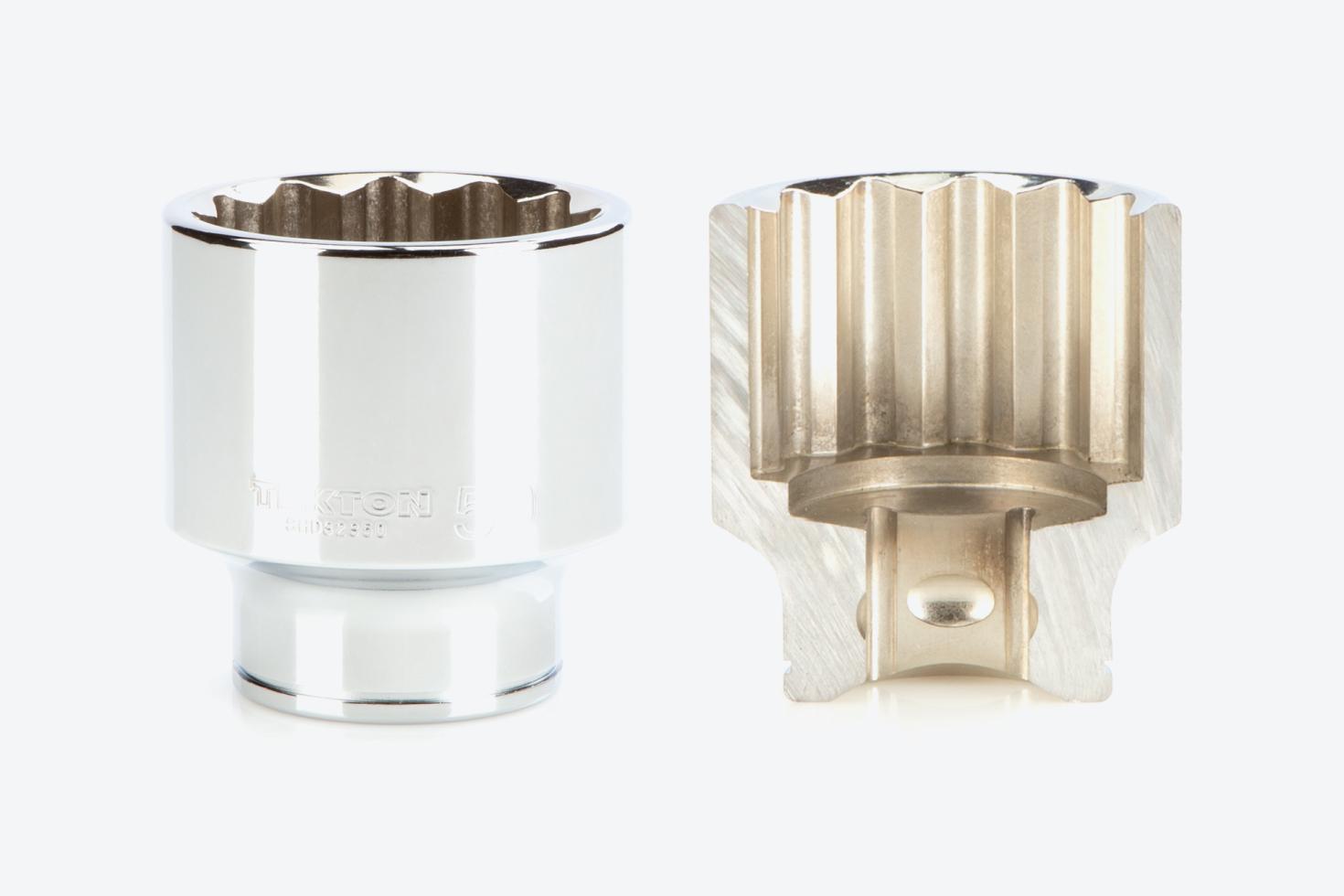 A 12-point shallow socket next to another socket that's cut in half, showing the exterior and interior finishes