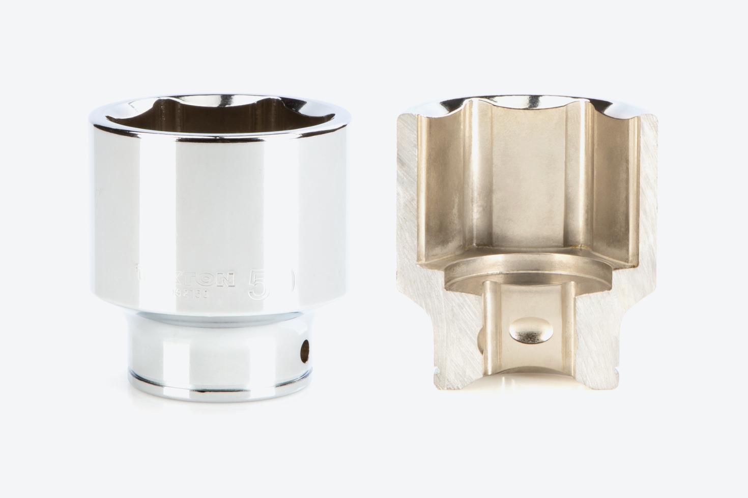A 6-point shallow socket next to another socket that's cut in half, showing the exterior and interior finishes