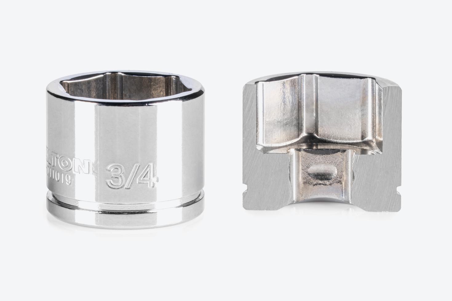 A 6-point extra-shallow socket next to another socket that's cut in half, showing the exterior and interior finishes