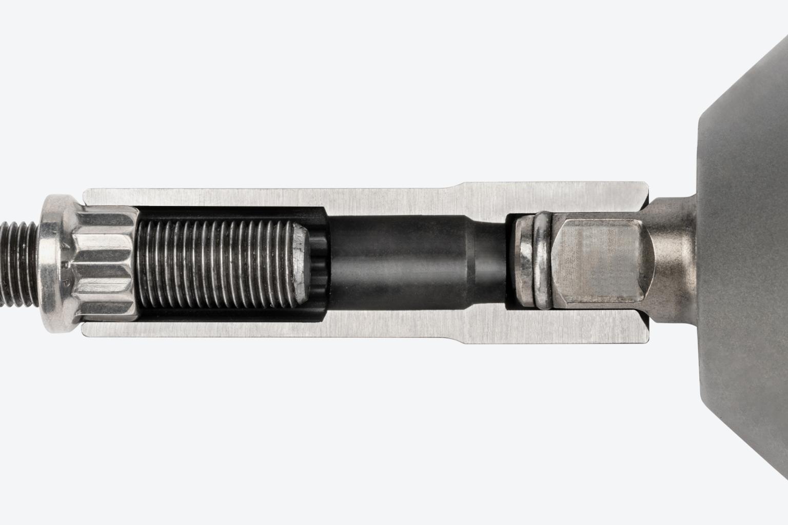 A cutaway view of a deep impact socket on a fitting, showing the full-length socket well.