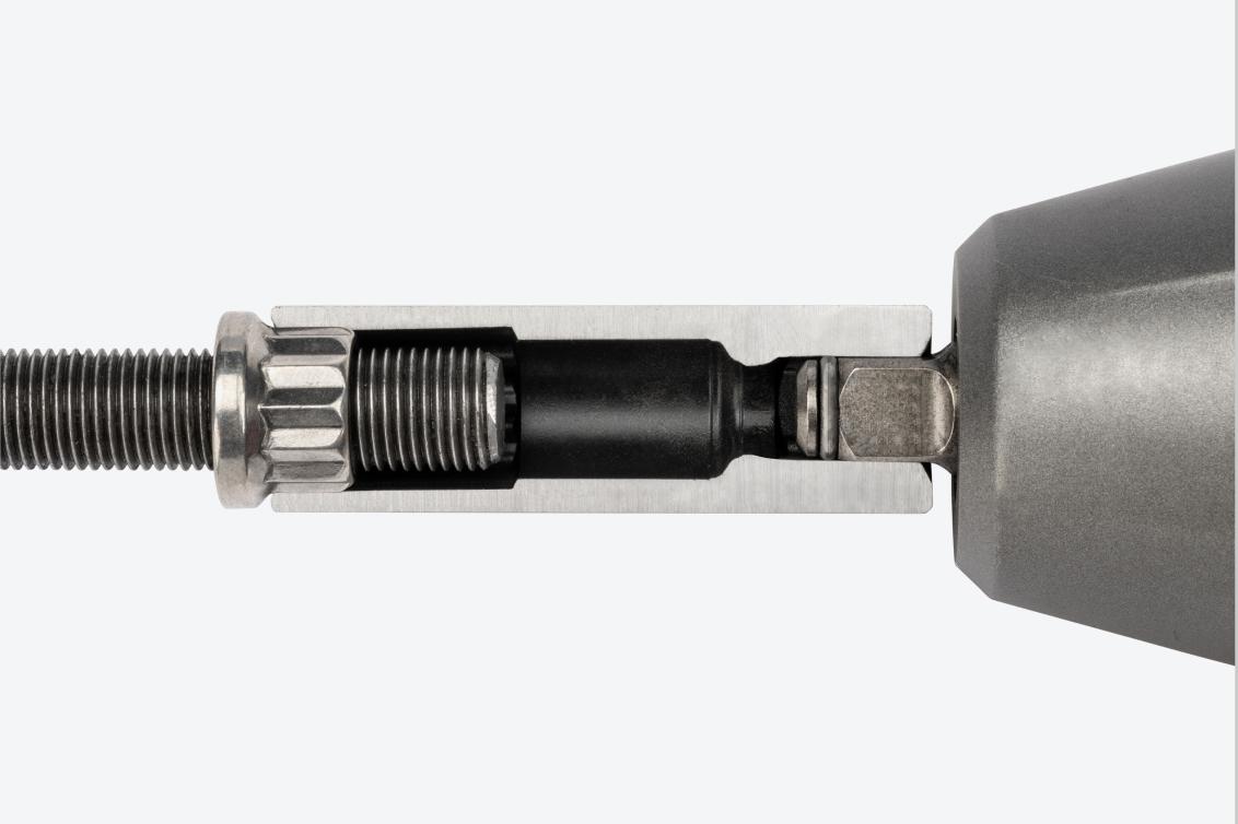 A deep 12-point impact socket cut in half to show the full-length socket well