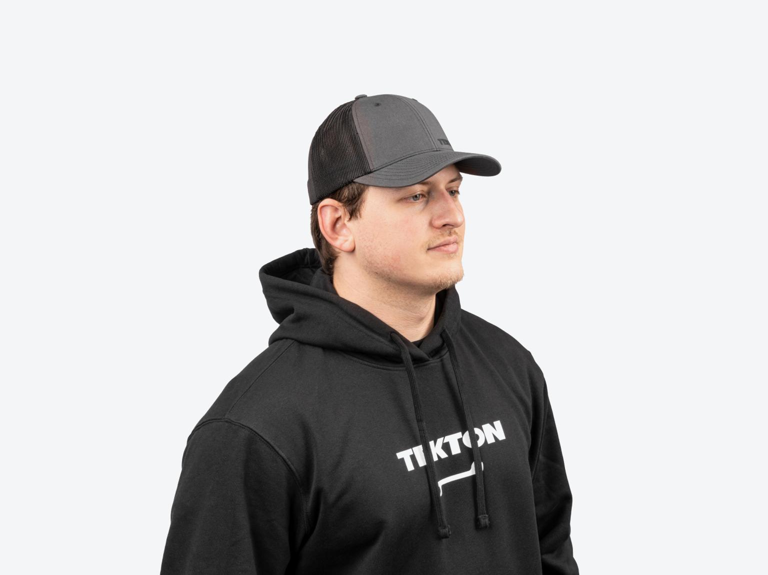 A man wearing a black heavyweight Tekton hoodie.