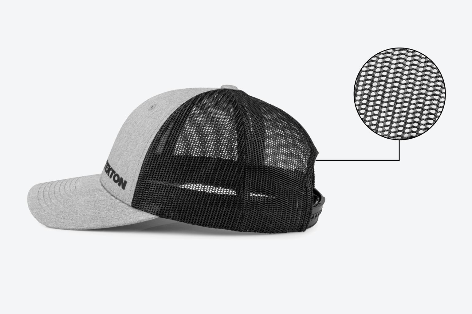 A gray low profile Tekton hat sitting on a light gray surface. An inset image shows a close-up view of the mesh.