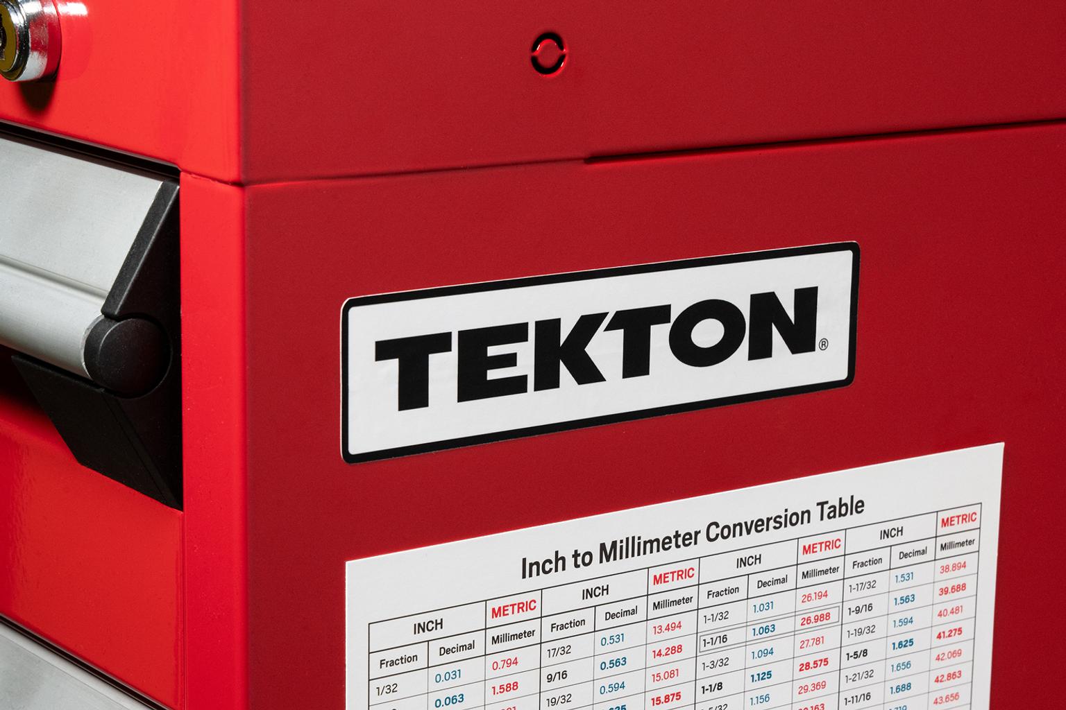 A Tekton sticker on the side of a red tool cabinet.
