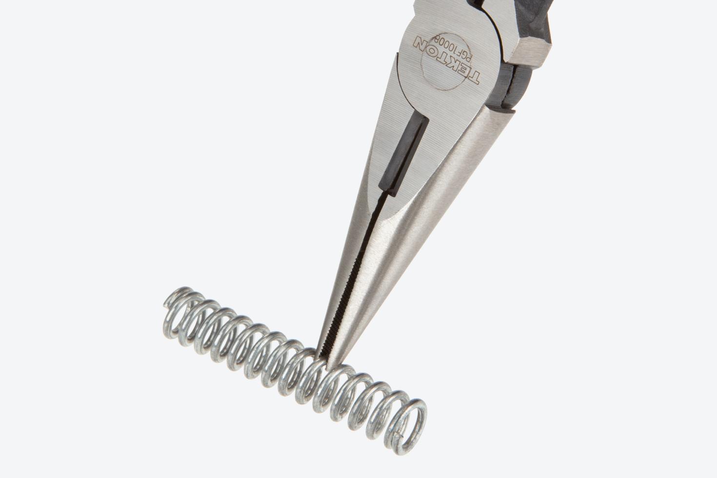 Pliers holding a spring