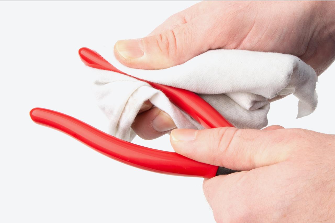 The vinyl grips of the pliers being cleaned