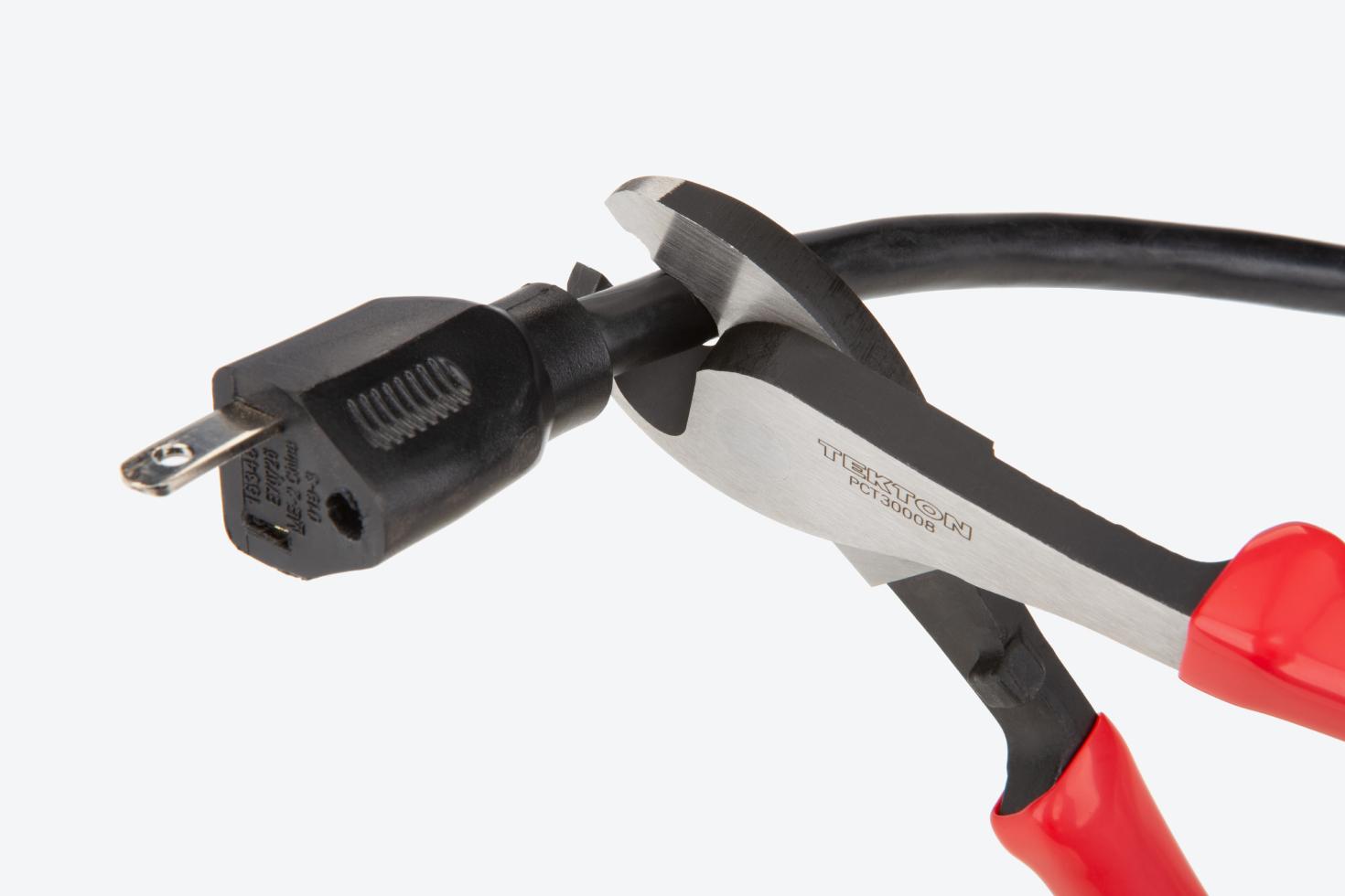Pliers cutting a power cable