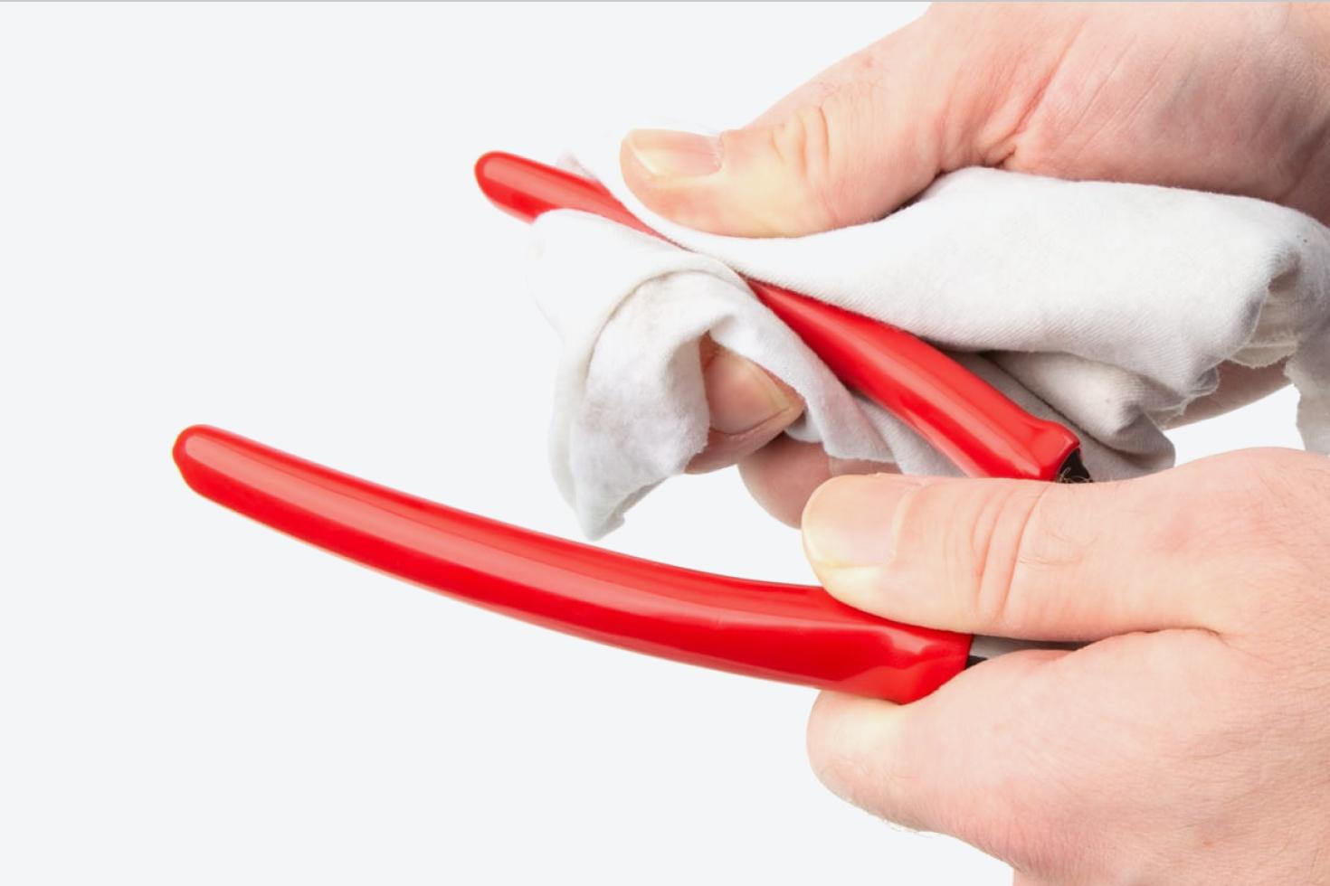 The vinyl grips of the pliers being cleaned