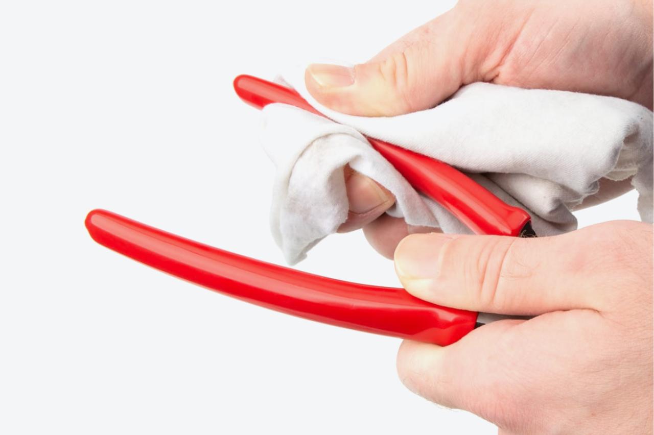 The vinyl grips of the pliers being cleaned
