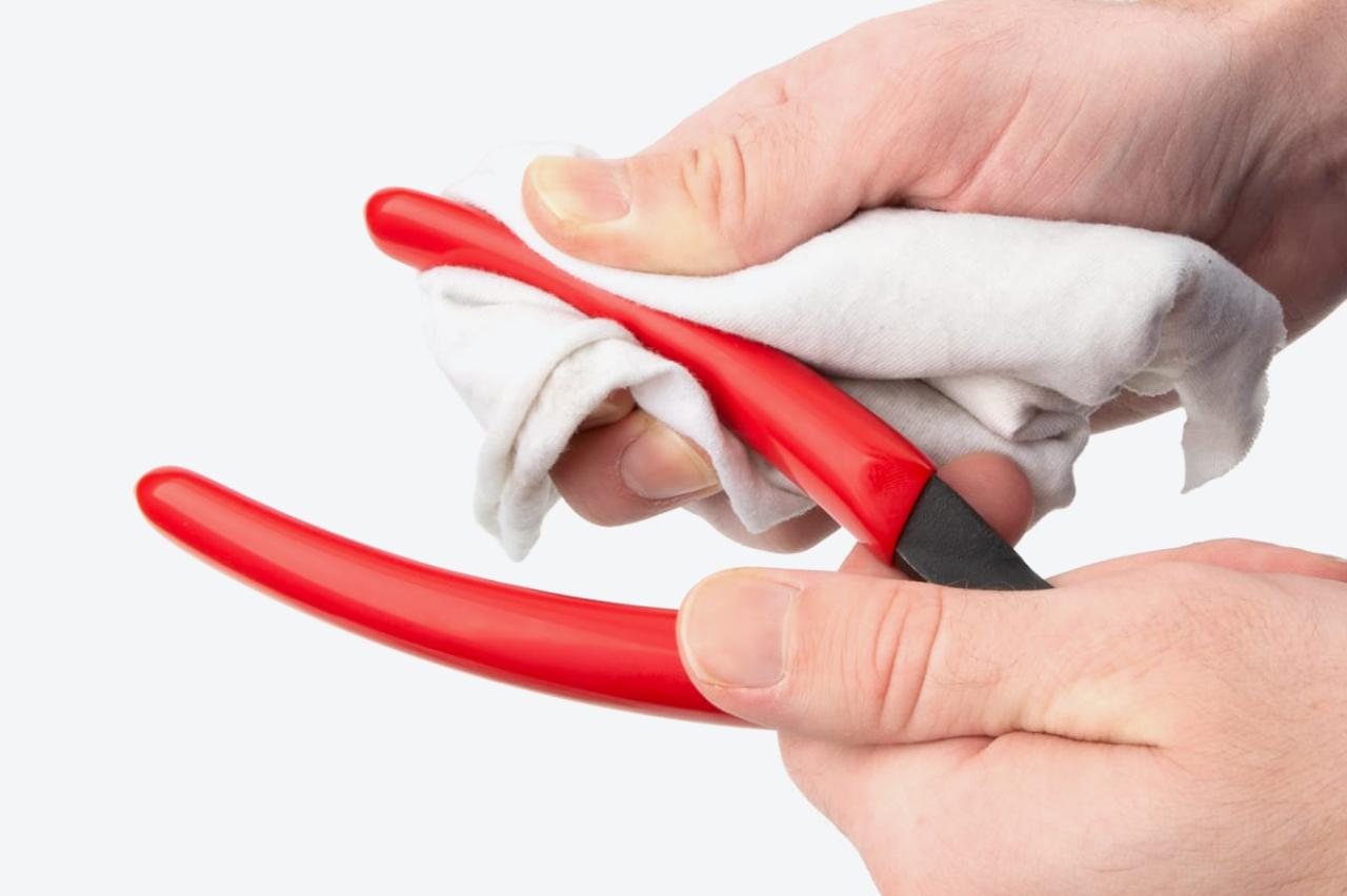 The vinyl grips of the pliers being cleaned