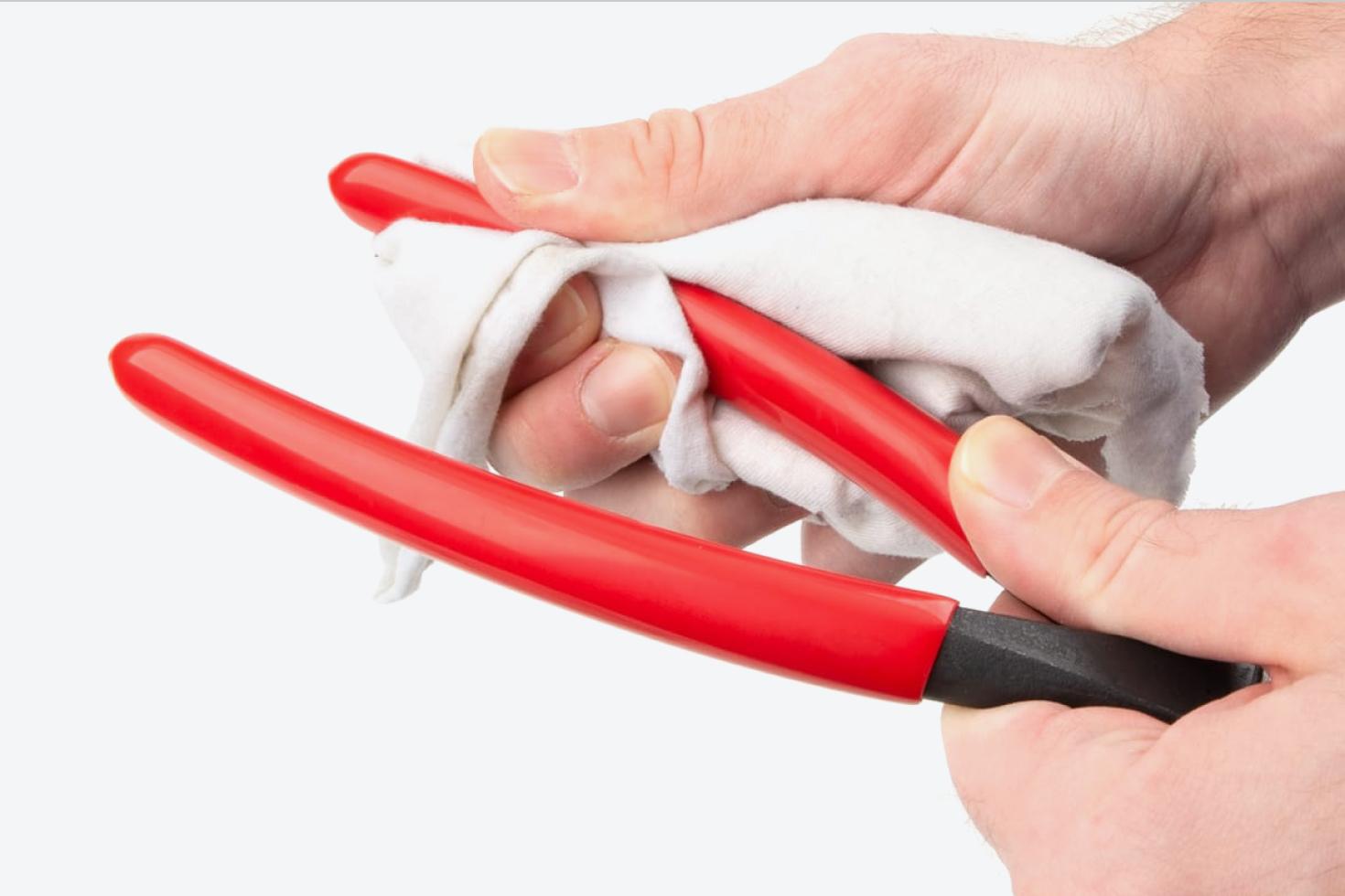 The vinyl grips of the pliers being cleaned