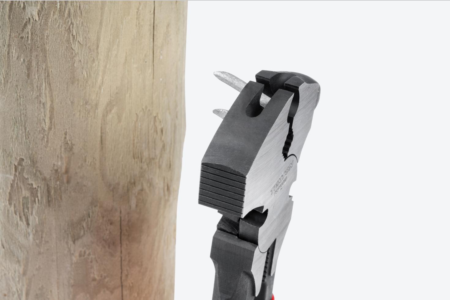 The pliers swinging into a post to start a staple