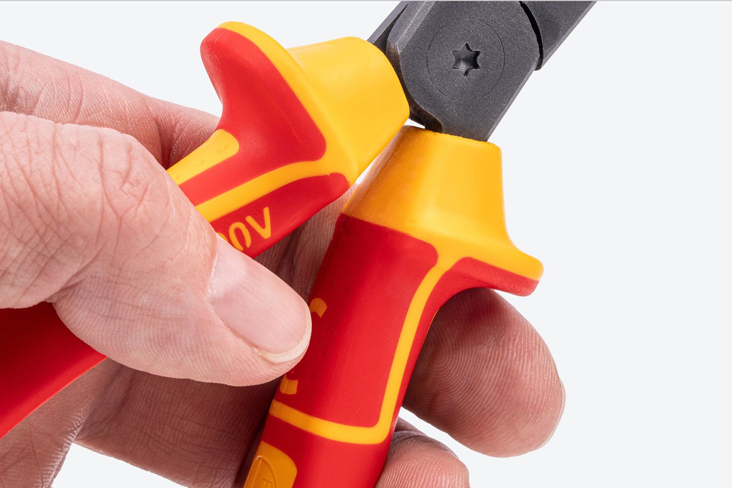 Close up view of the flared handles of Tekton insulated long nose pliers #PVG10008.