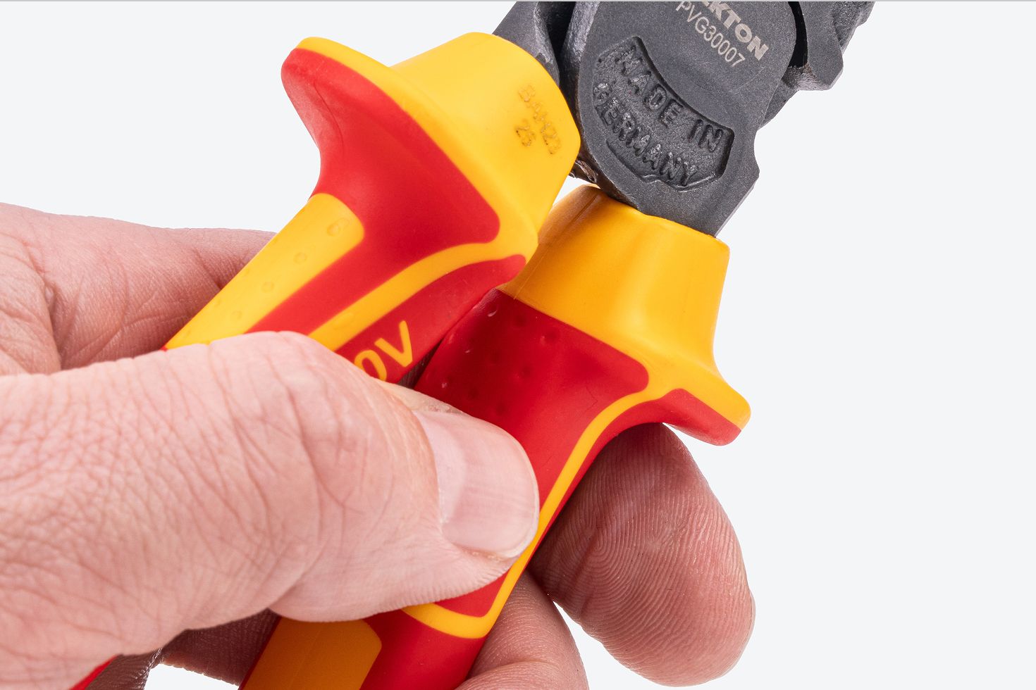 Close up view of the flared handles of Tekton insulated combination pliers #PVG30007.