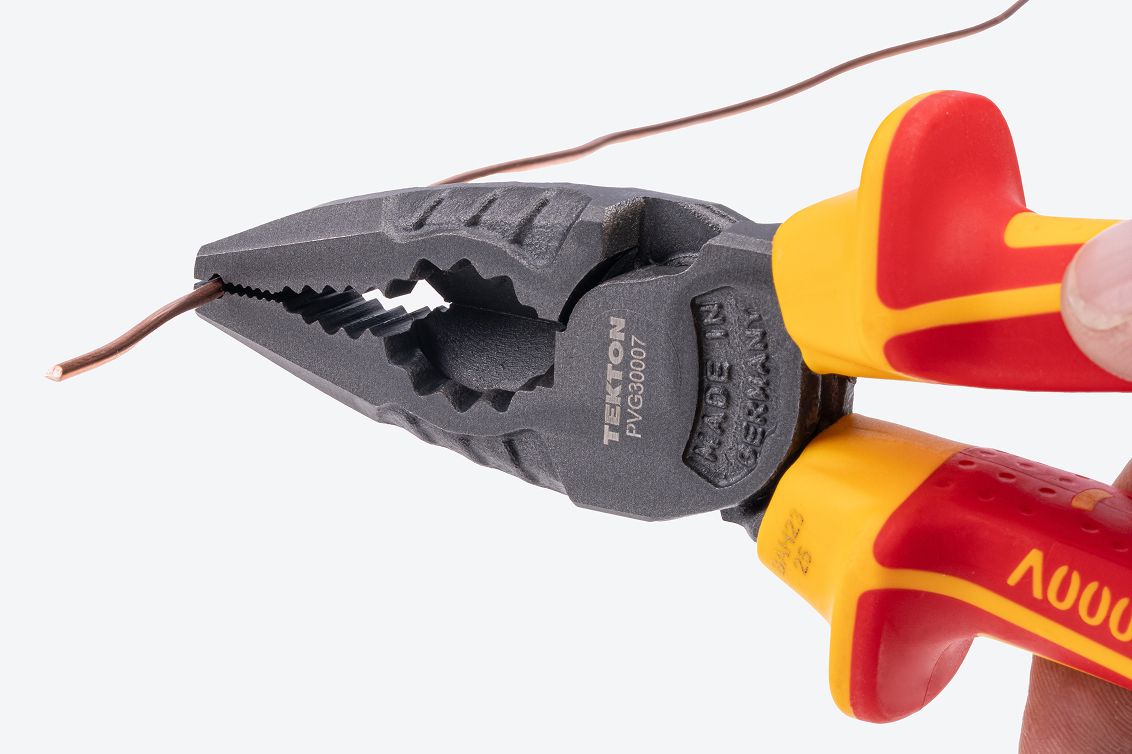 Tekton insulated combination pliers #PVG30007 holding a wire.