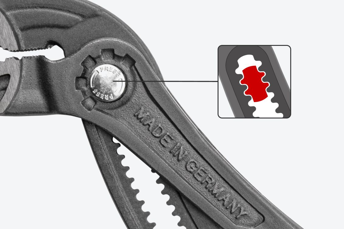 Graphic showing how the button teeth interlock with the slots on the grooved track.