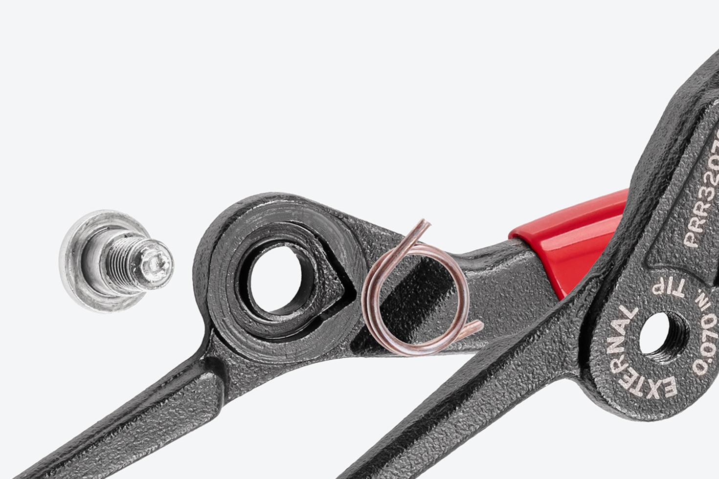 Close-up exploded view of Tekton retaining ring pliers, showing the spring and bolt.