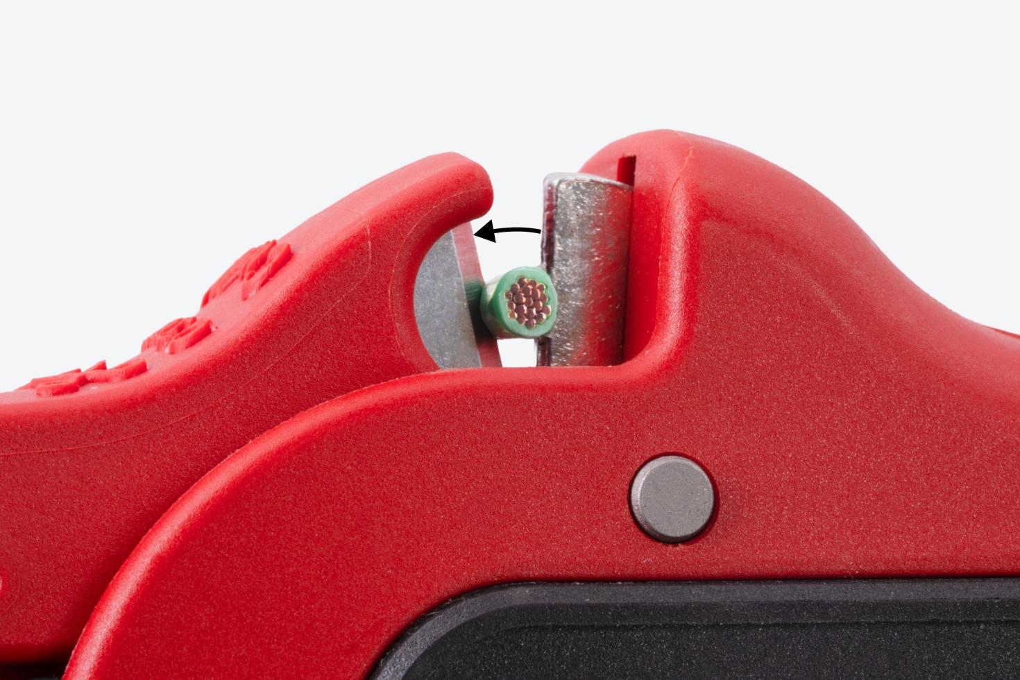 Close-up view of the wire cutting blades cutting a wire.