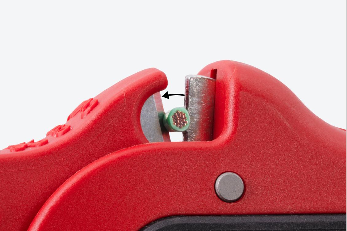 Close-up view of the wire cutting blades cutting a wire.