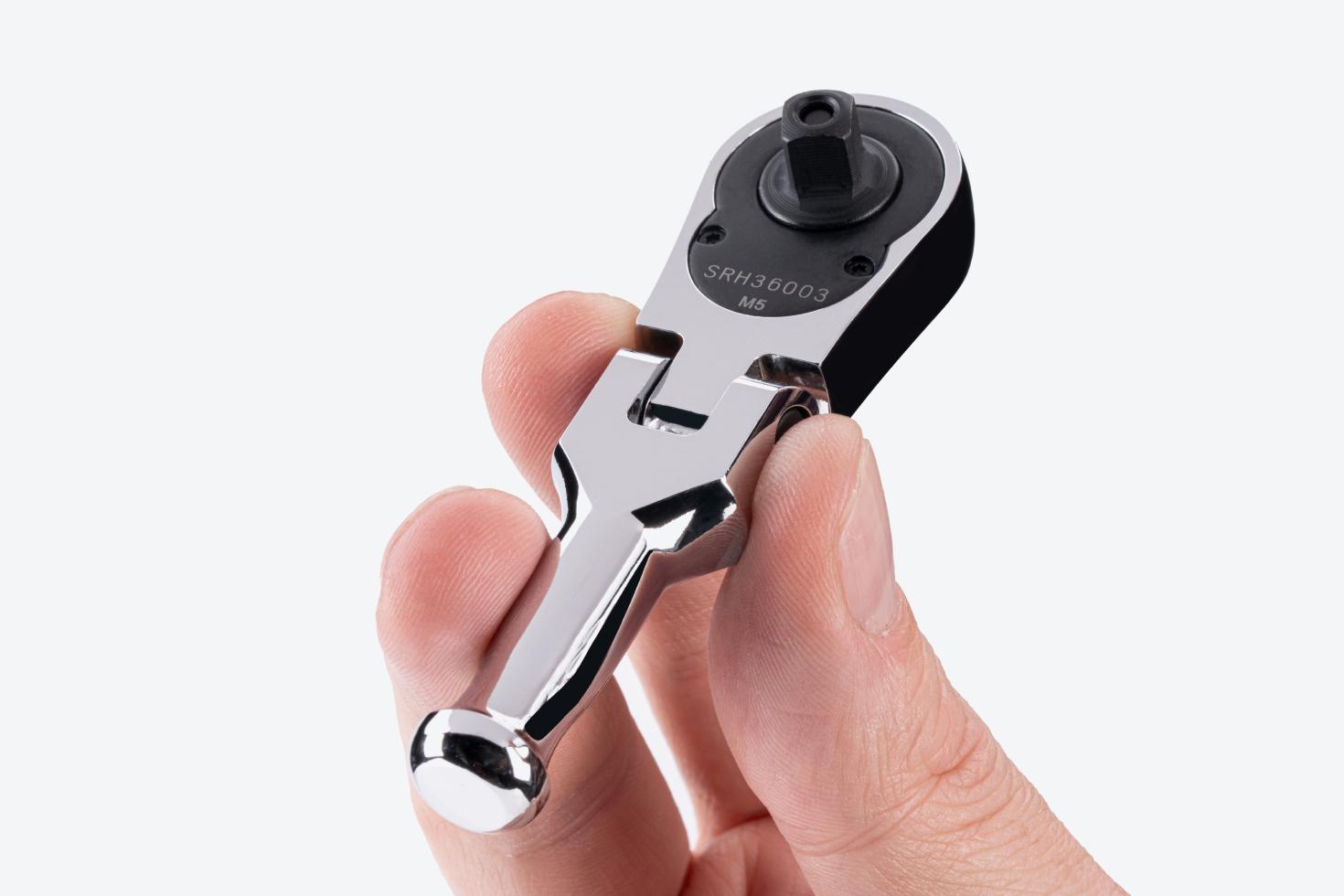 A 1/4 inch drive stubby ratchet being held