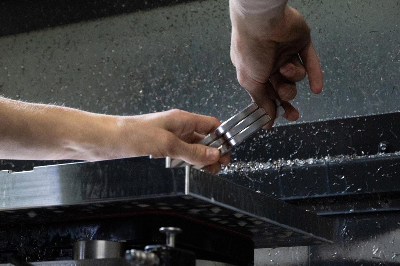 Service wrenches being removed from a CNC mill.