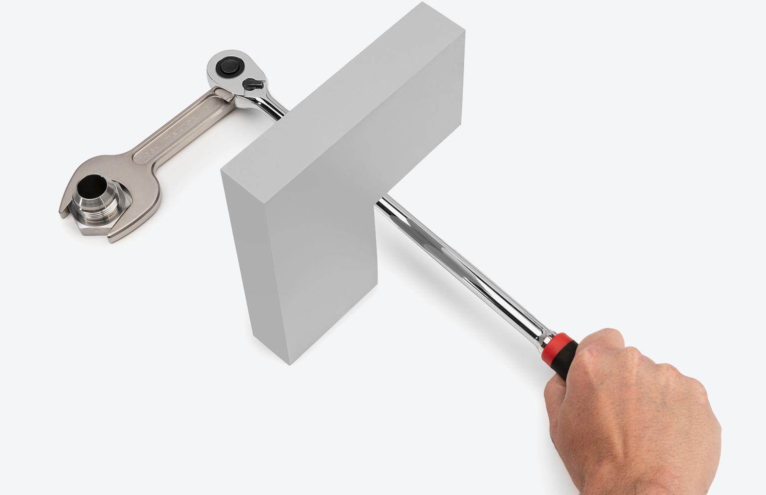 A ratchet attached to a Tekton service wrench in order to reach around an obstacle.