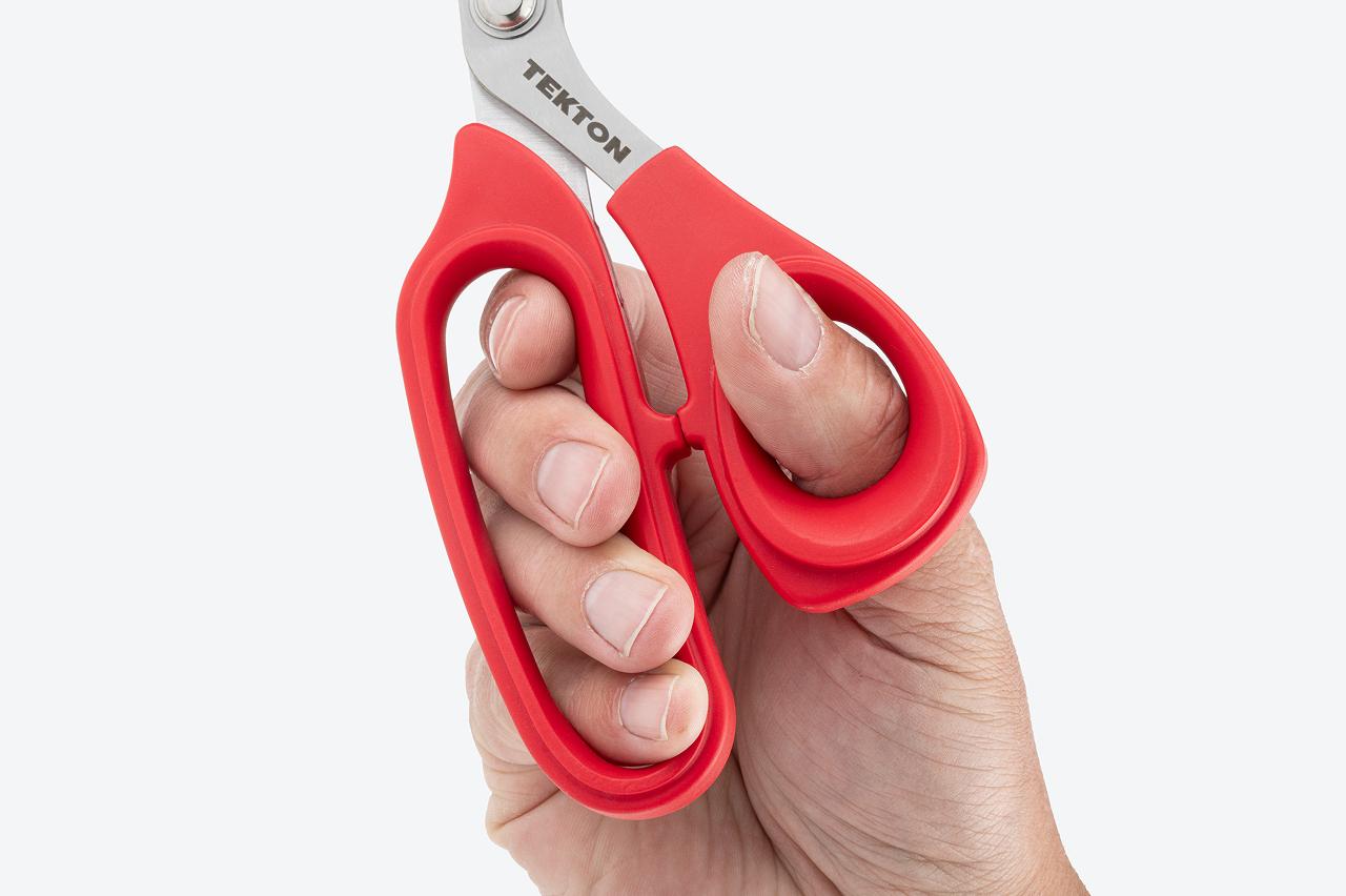 A close-up image of the scissors being held by the handles