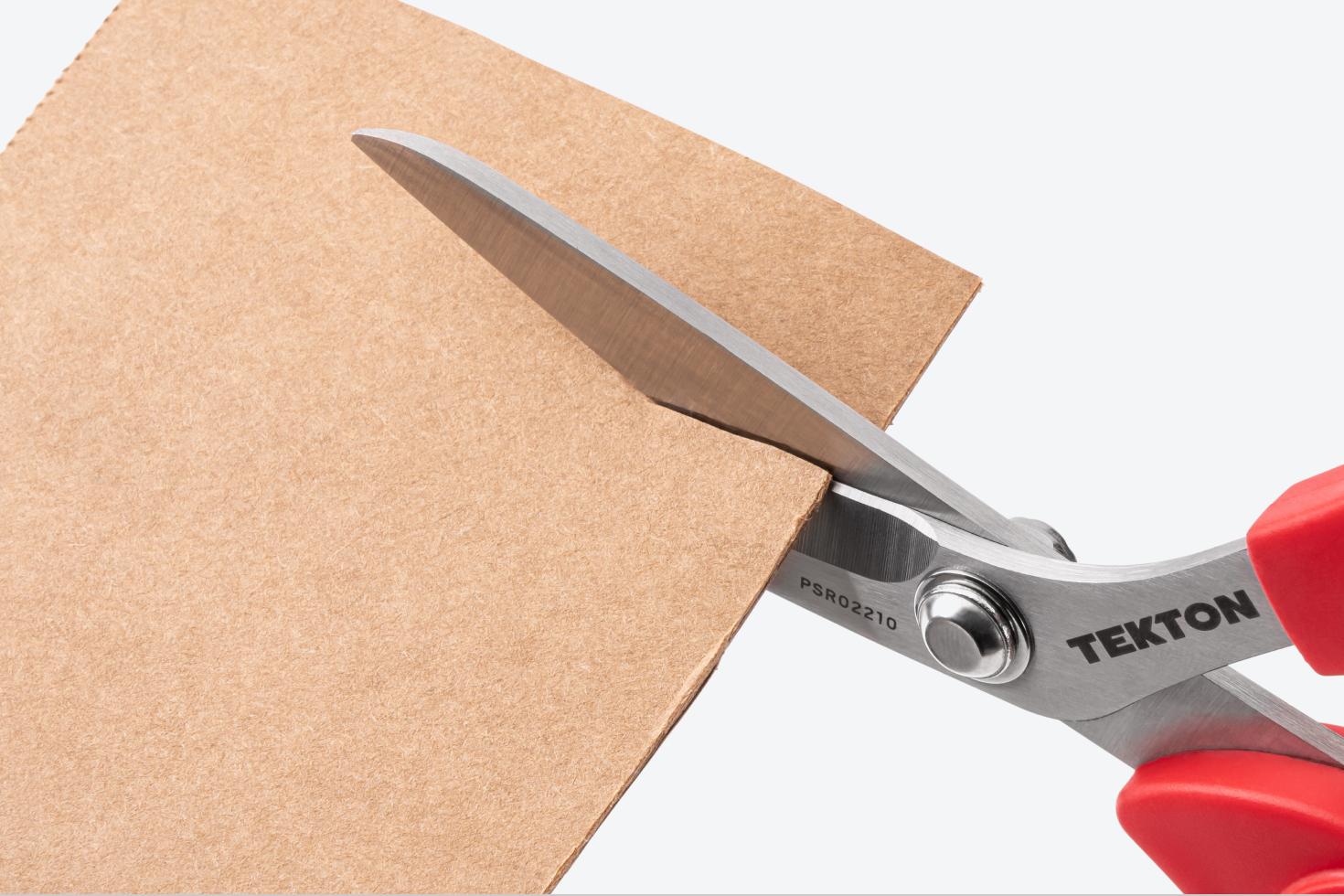 Scissors cutting cardboard
