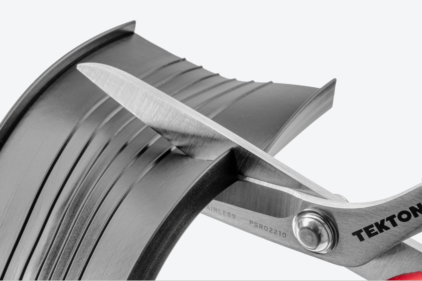 Scissors cutting a garage door seal