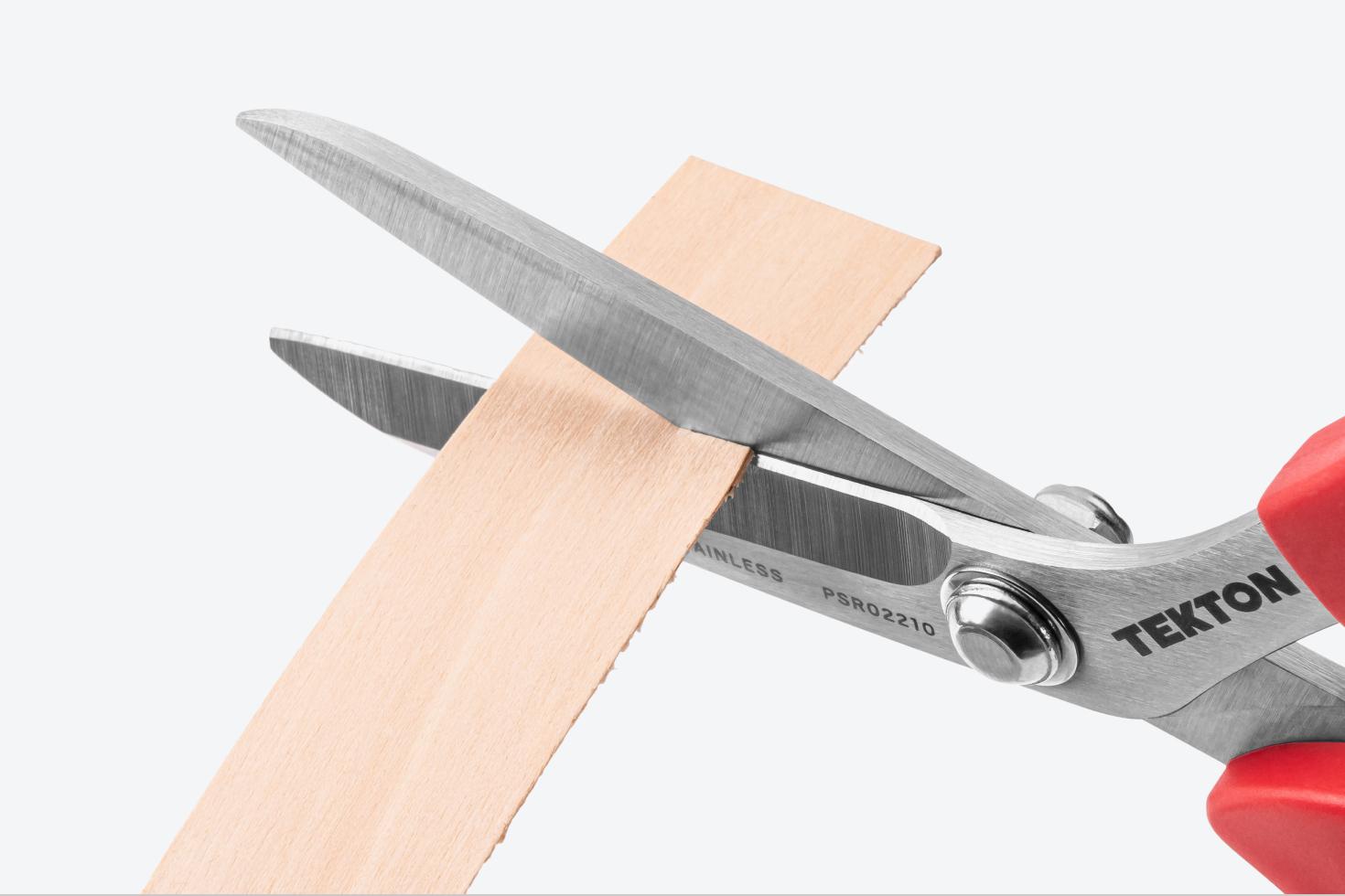 Scissors cutting wood edge banding