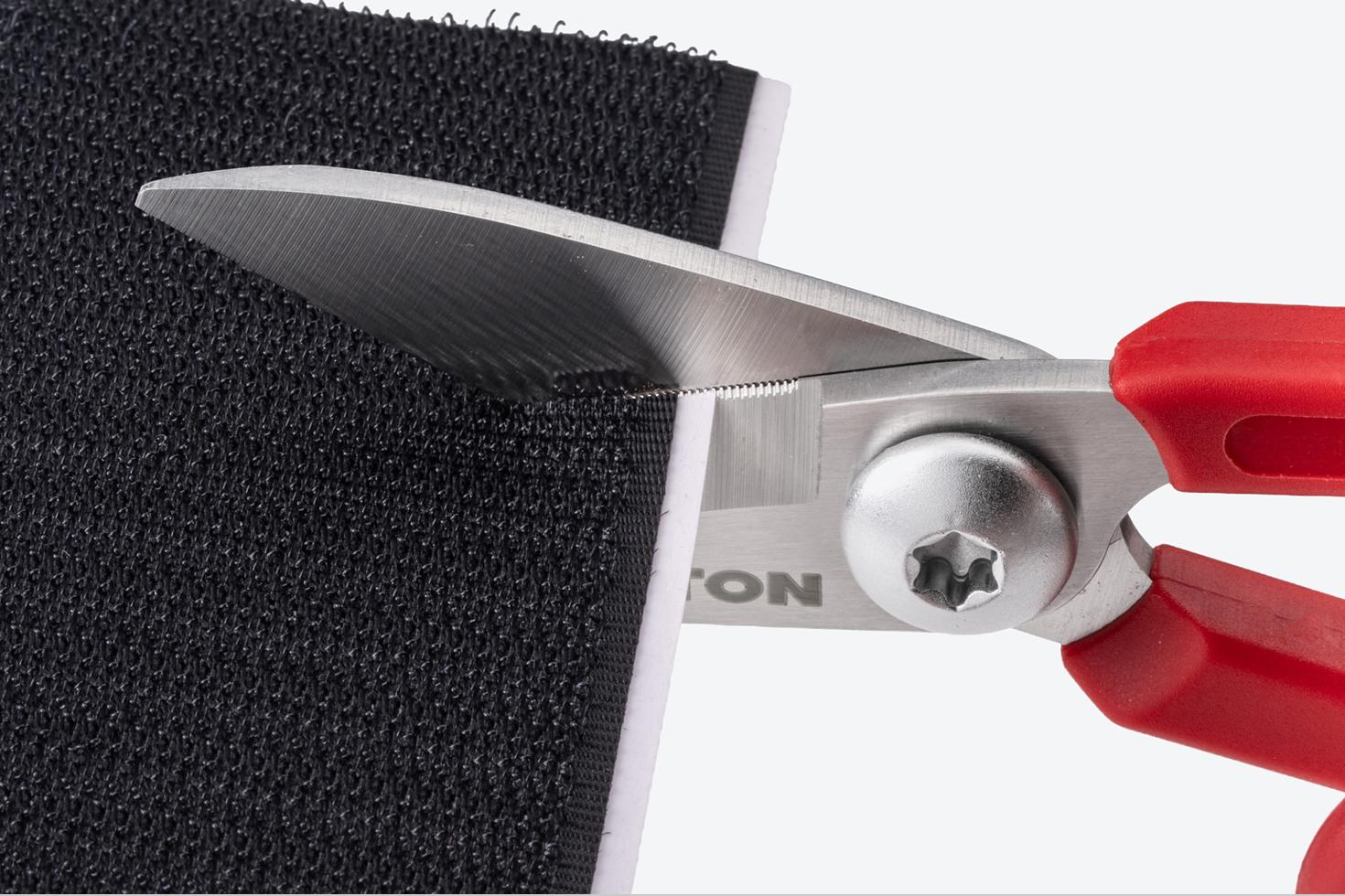 Scissors cutting a hook-and-loop fastener
