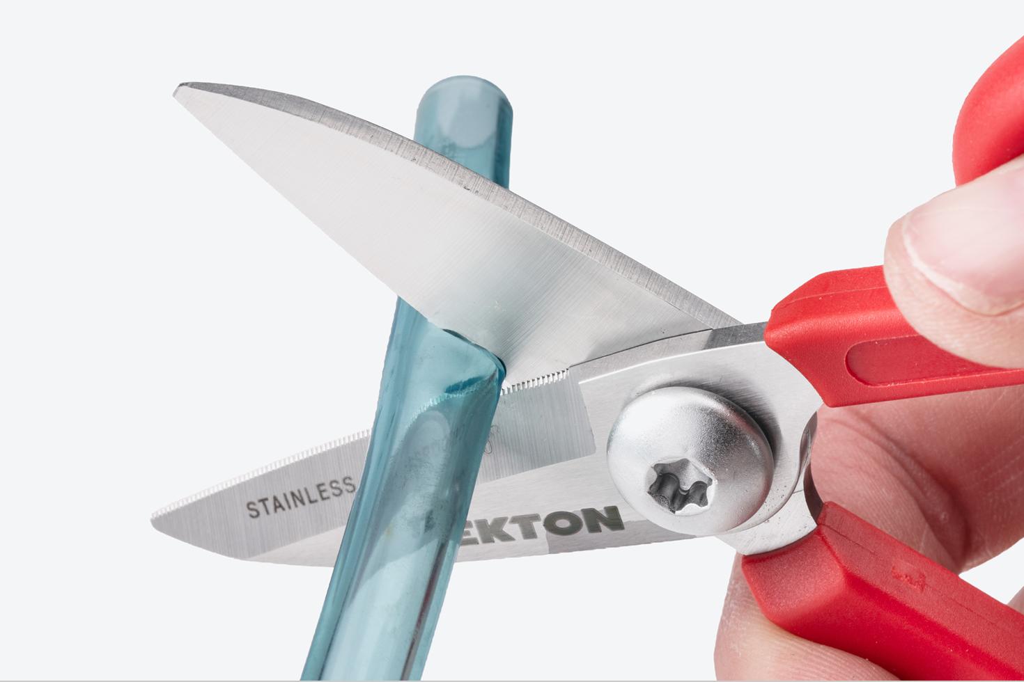 Scissors cutting tubing